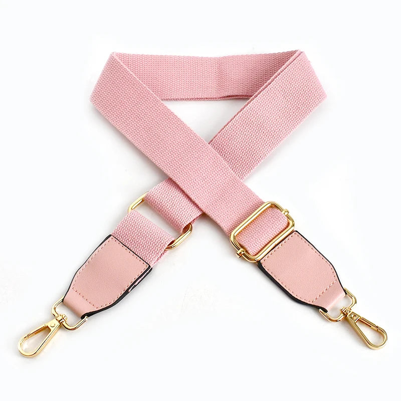 Pink canvas cotton bag strap with gold metal hooks shown in an X-shape