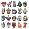 A collection of decorative shoe charms and pins featuring various animal faces and designs.