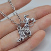 Silver necklace featuring a detailed Western cowboy boot and hat horseshoe charm