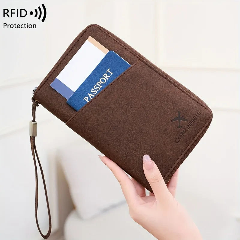 A brown passport wallet with a wrist strap is shown, containing a passport card.