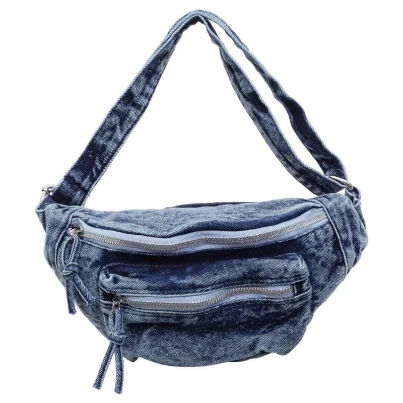 Sac bandoulière en denim vintage bleu foncé délavé avec fermeture éclair.