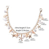 A delicate gold and pearl layered chain necklace featuring starfish and seashell charms.