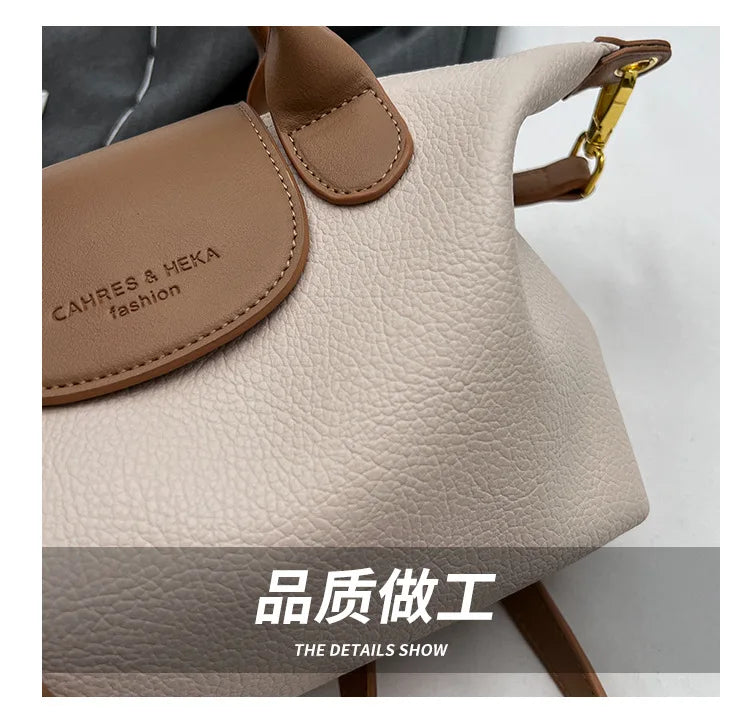 A light beige vintage PU leather crossbody handbag with brown leather trim and gold hardware.