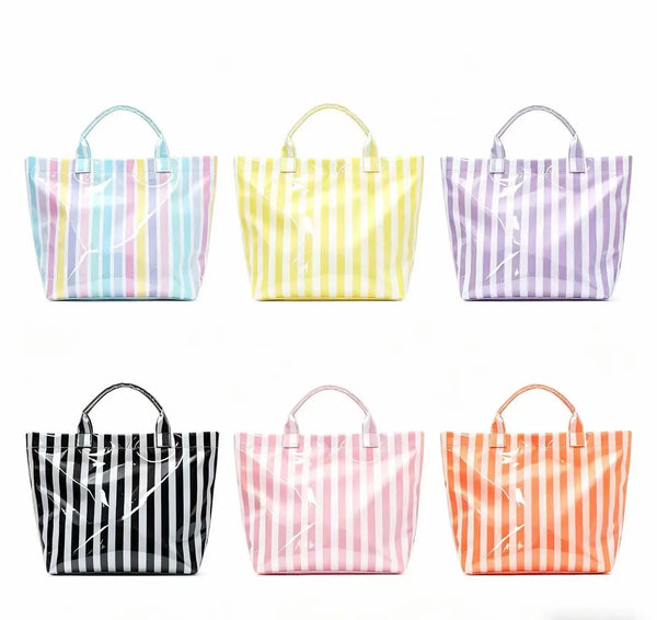 A collection of six striped tote bags in various colors including pink, yellow, purple, black, and orange.