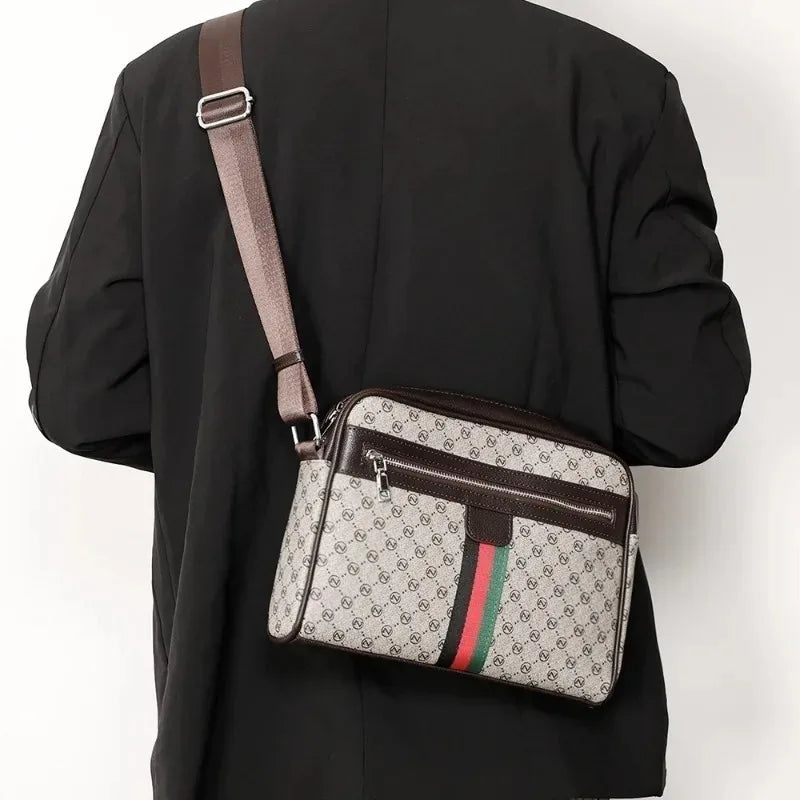 A black blazer is shown holding a brown leather letter print crossbody sling bag with green and red stripes.