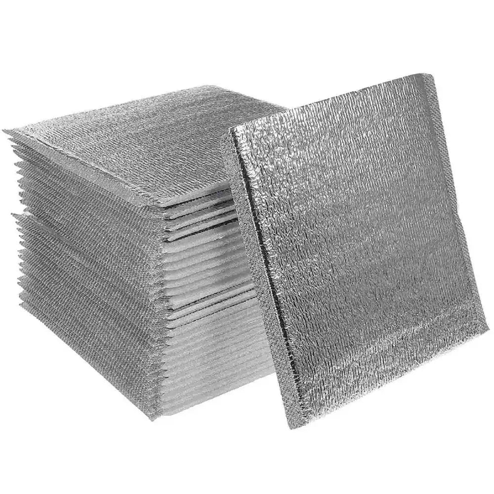 Stack of silver insulated thermal food delivery bags with aluminum foil lining