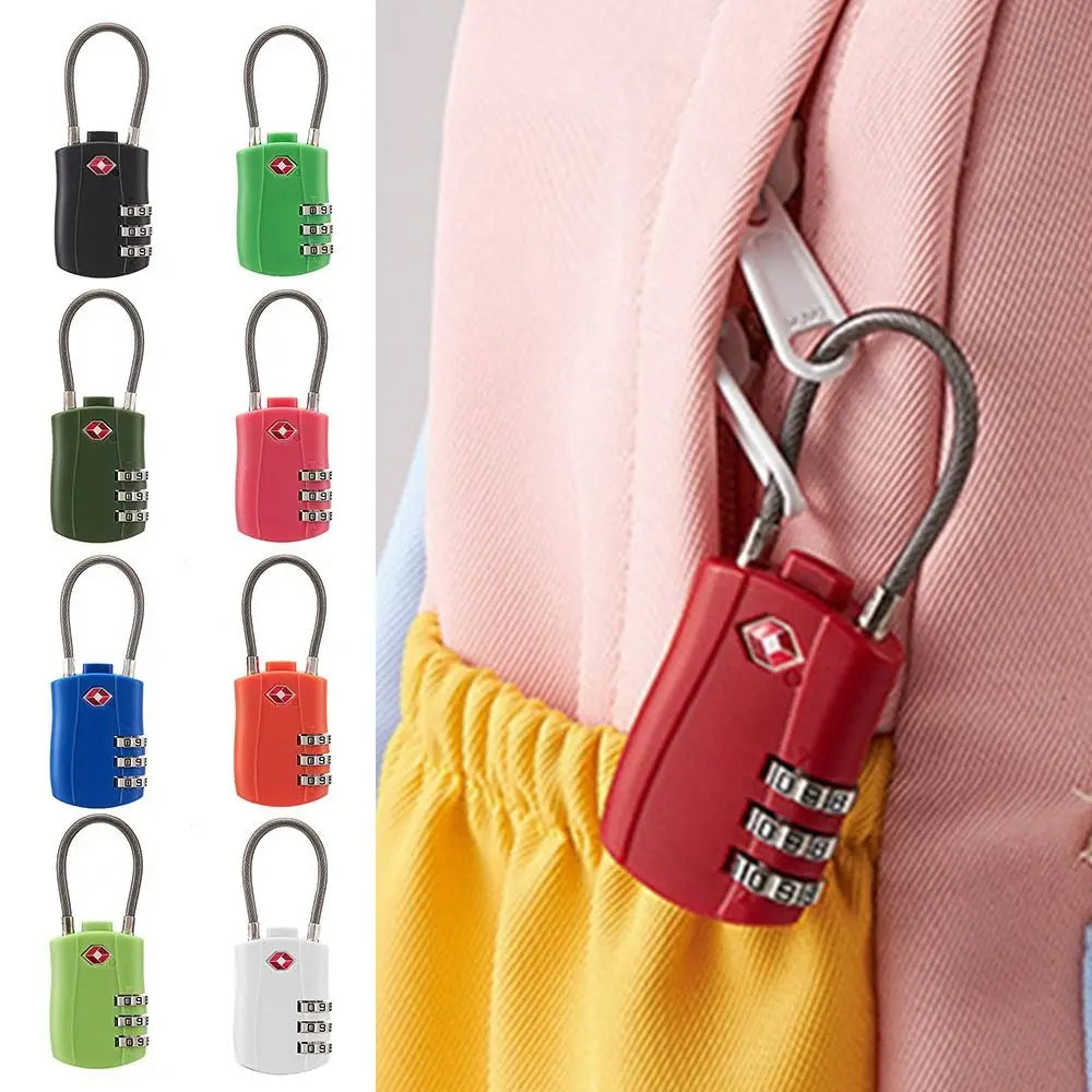 A close-up view of various color combination cable locks, including black, green, red, blue, and white, attached to a pink ga