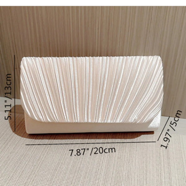 A rectangular, light beige luxury chain shoulder clutch bag with vertical pleats shown on a surface.