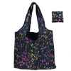 A reusable nylon tote bag with a dark background and scattered pink and green floral patterns.