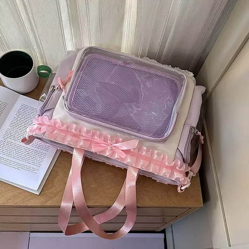 A light purple transparent shoulder tote bag with pink trim resting on a wooden surface.