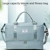 A light blue duffel bag with a handle and shoulder straps is shown against a white background.