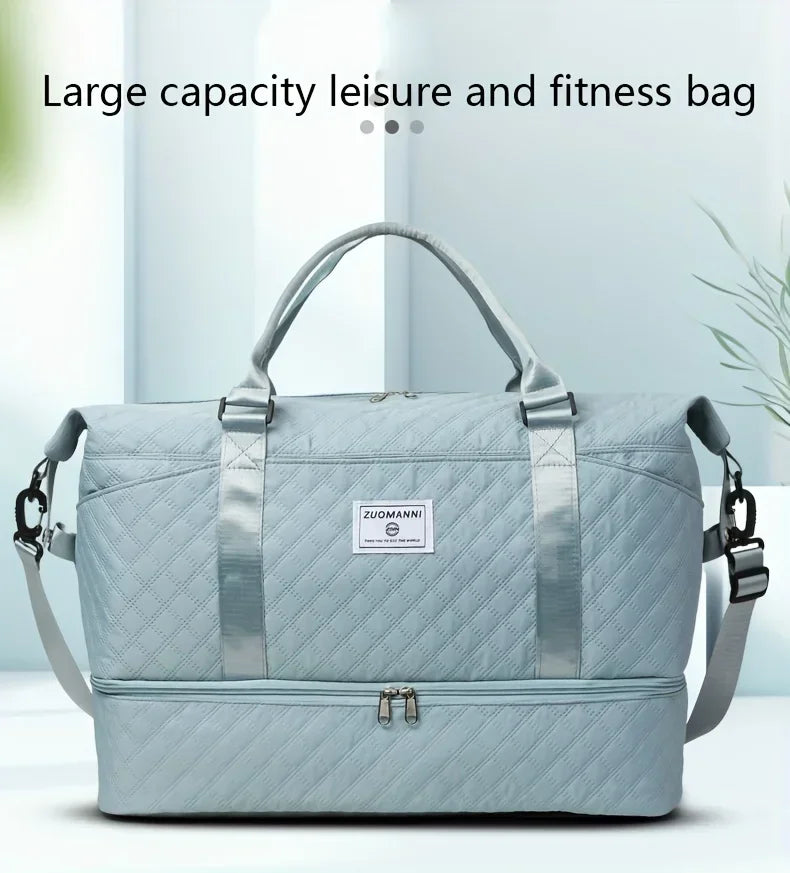 A light blue duffel bag with a handle and shoulder straps is shown against a white background.