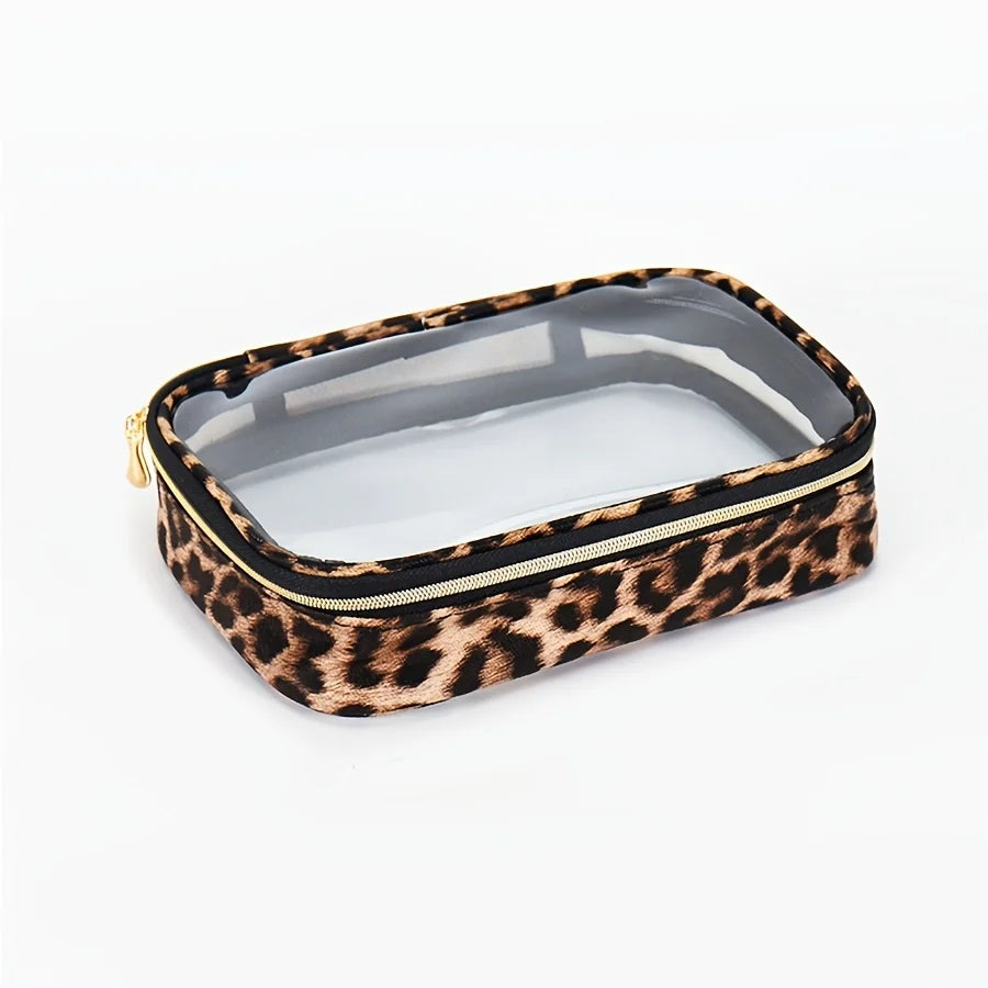 A rectangular leopard print cosmetic bag with a clear lid and black zipper, designed as a waterproof travel organizer.