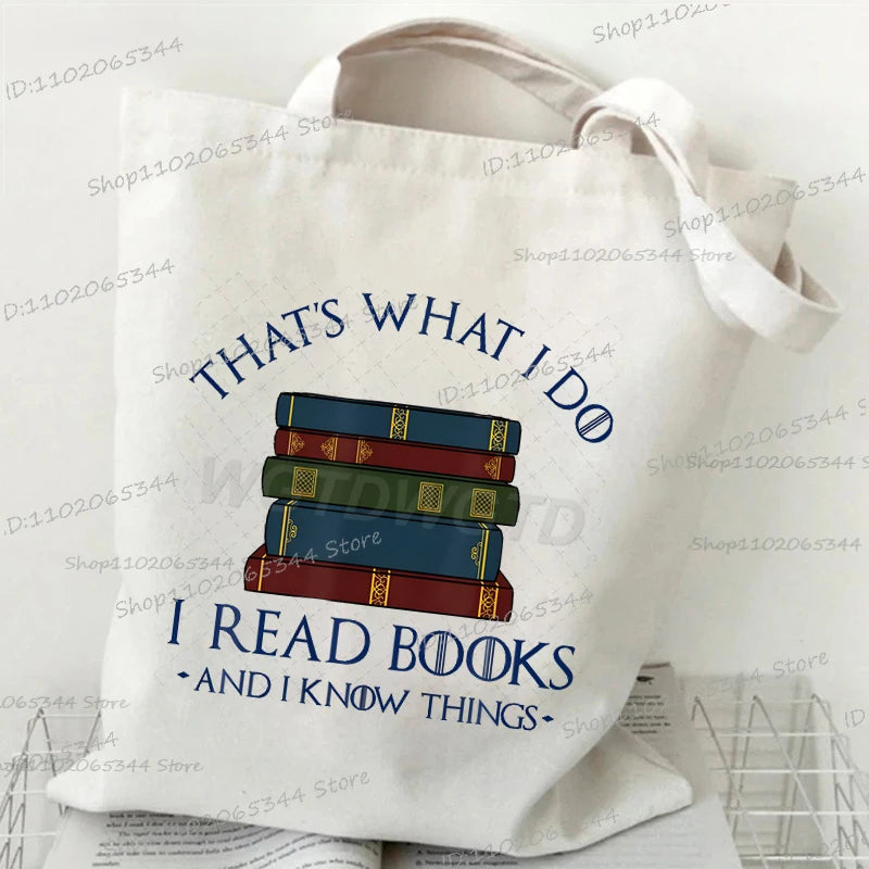 A white canvas tote bag featuring text that reads THAT'S WHAT I DO I READ BOOKS AND I KNOW THINGS