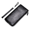 Black PU leather men's clutch wallet with a black strap shown diagonally.