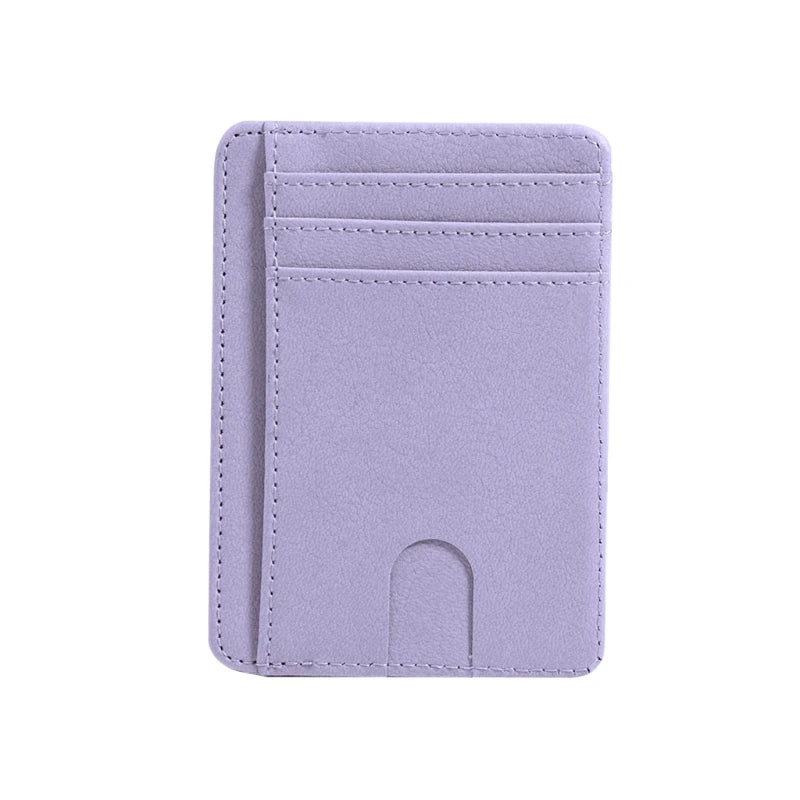 A slim purple leather card holder wallet with stitched edges and a slot for cards.