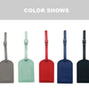 A row of five PU leather luggage tags in shades of gray, mint green, red, blue, and black.