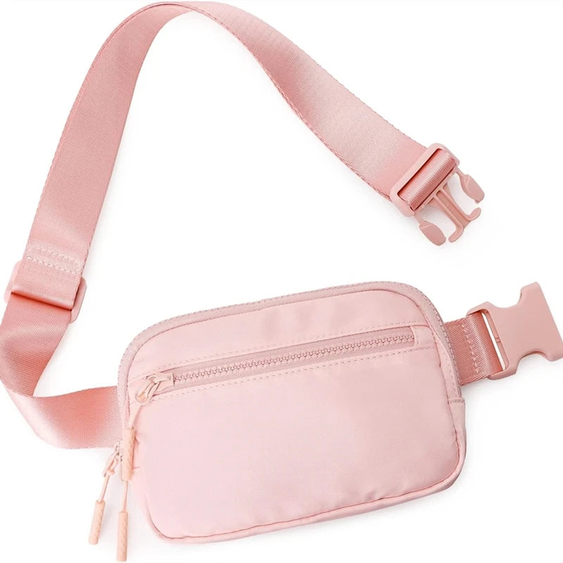 A pink multi-functional crossbody storage bag with a strap and zipper pocket.