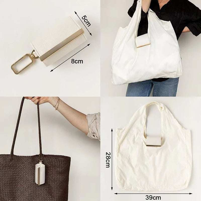 White cloth storage pouch with a gold keychain attached, shown in various angles.
