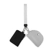 A black mini zip around wristlet wallet with a white strap attached.