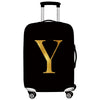 Black luggage with a gold letter Y on the side
