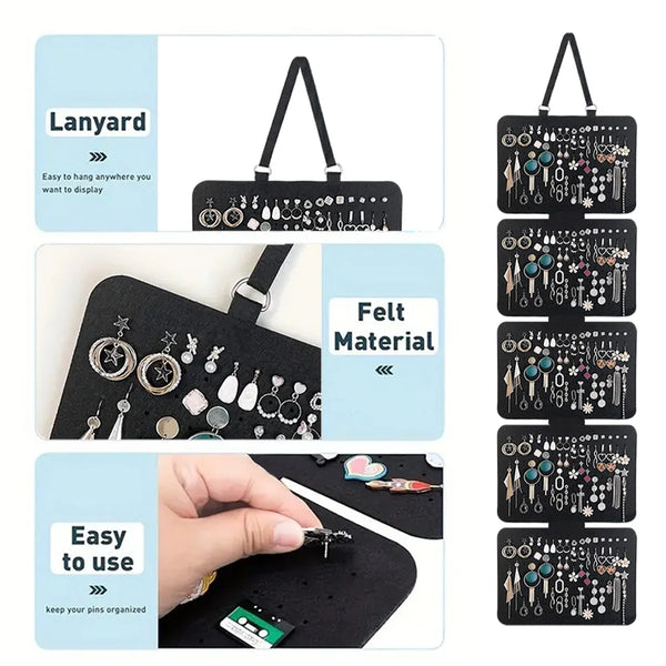 A black felt material jewelry organizer with a lanyard, showing various pins and jewelry items.