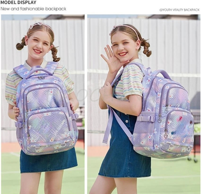 A girl is shown wearing a purple plaid Oxford cloth school backpack in a light purple color.