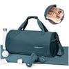 A navy blue waterproof travel duffel bag with a shoe compartment and accessories lying on a light blue mat.