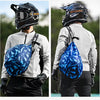 A person wearing a black MotoWolf helmet is shown with a blue fabric backpack, ready for cycling or travel.