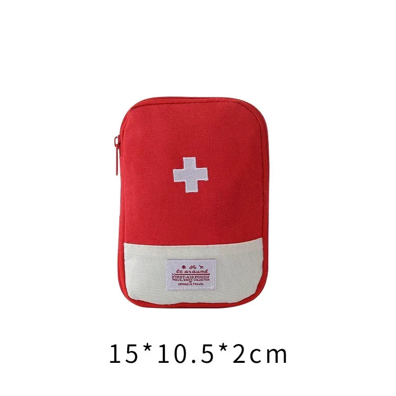 A red portable first aid kit storage bag with a white cross emblem and text on the front.
