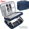 Two dark blue portable digital organizer storage pouches with zippered compartments and mesh pockets.