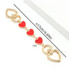 Gold alloy moon-shaped bag chain strap with clasp and heart charms