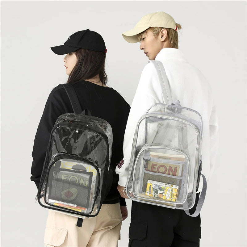 A person is holding a waterproof transparent backpack with a clear plastic design and various items inside.