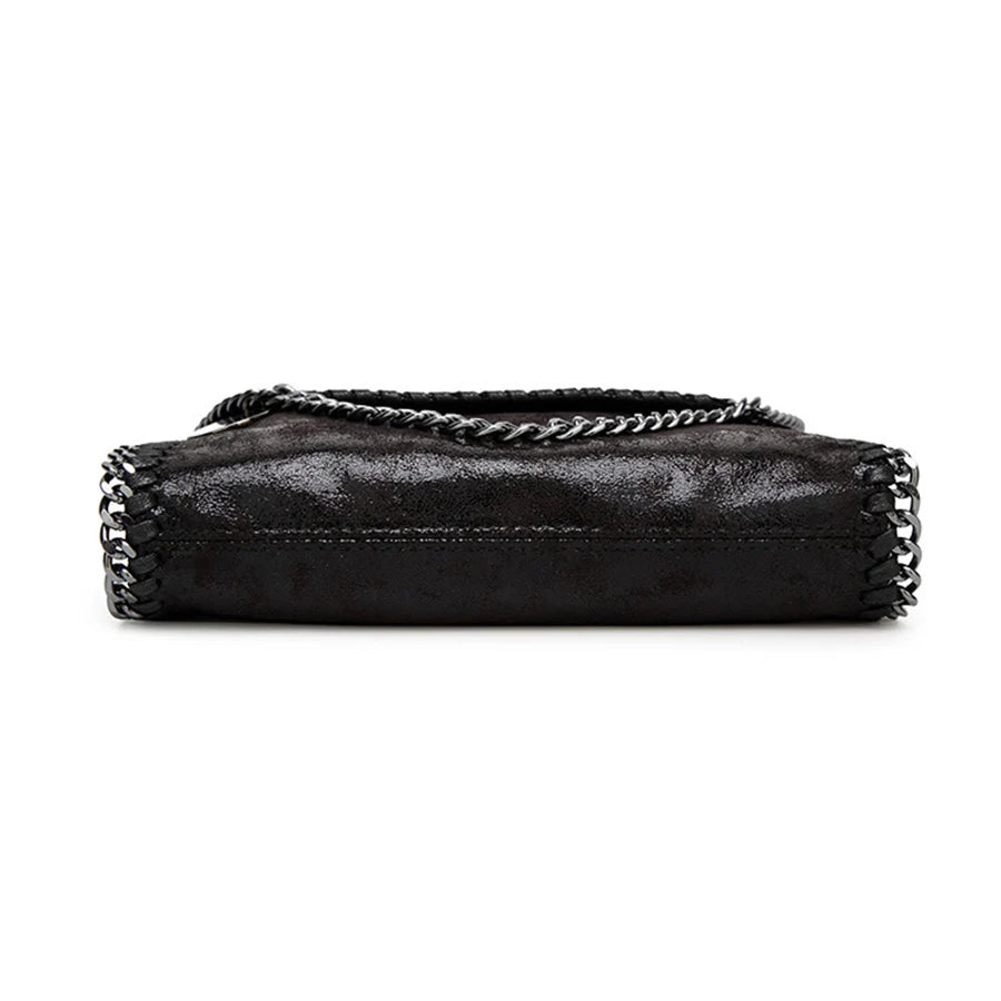 A black vintage flap crossbody bag with a silver chain strap.