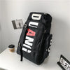 Black waterproof travel gym backpack featuring white text and red accents.