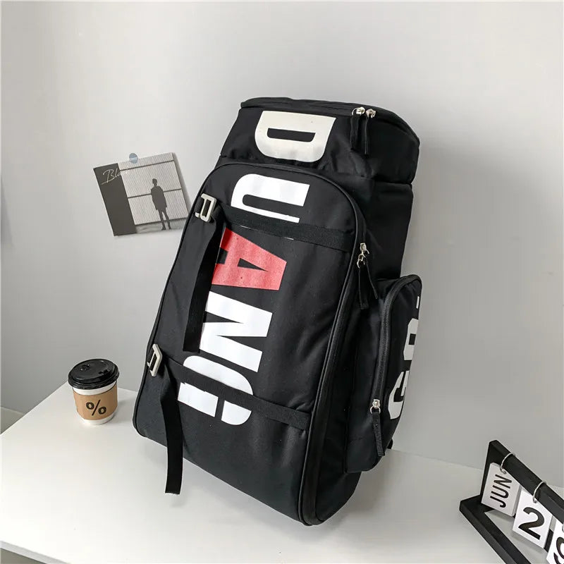 Black waterproof travel gym backpack featuring white text and red accents.