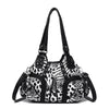 A black and white leopard print PU leather tote bag with a black adjustable strap.