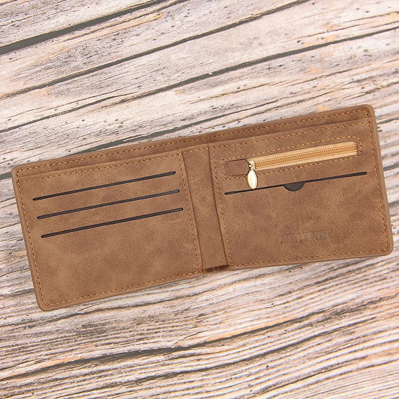 A brown slim leather wallet for men with a zippered coin pocket resting on a weathered wooden surface.