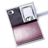 Elegant pink leather passport holder with a clear window displaying currency and a passport