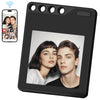 A black photo transfer tag featuring a portrait of a young woman and a young man.