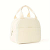 A cream-colored reusable thermal insulated bento bag with light beige fabric handles.
