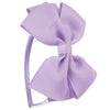 A close-up of a lavender striped bow headband.