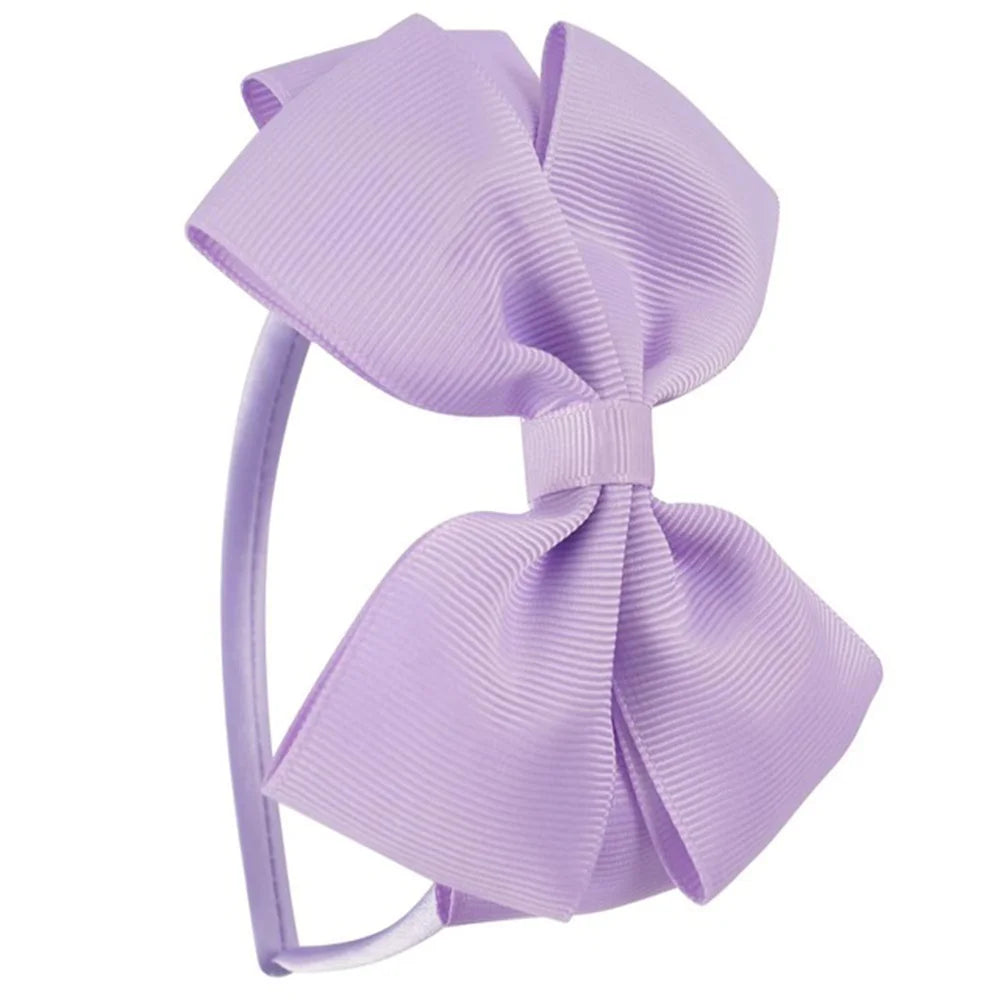 A close-up of a lavender striped bow headband.