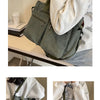A person is holding a dark olive green textured corduroy tote bag with adjustable straps against a light background.