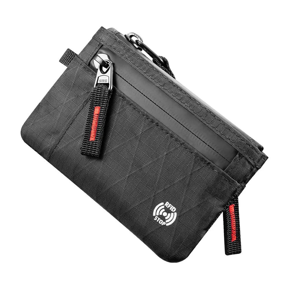 A black RFID blocking travel wallet with a carabiner clip.