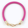 A pink quilted PU leather replacement bag strap with gold-toned metal buckles.