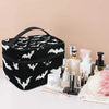 Bolsa portátil negra para maquillaje con productos y herramientas