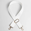 White adjustable crossbody bag strap with a maze pattern and gold-toned hardware