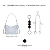 Silver extended and decorative chains with a white patterned bag and charms