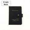 Black D style passport cover with gold embossed airplane design
